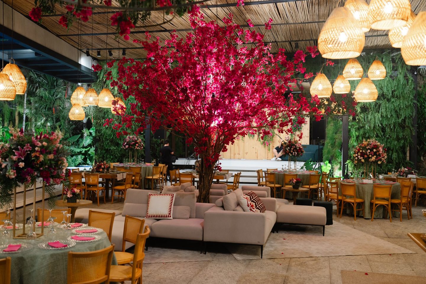 Reception lounges under a tree of pink flowers